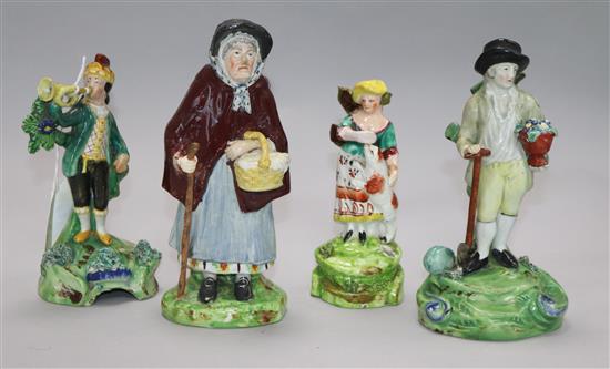 A Staffordshire figure of a gardener by Walton. And three other figures. Height: 16cm